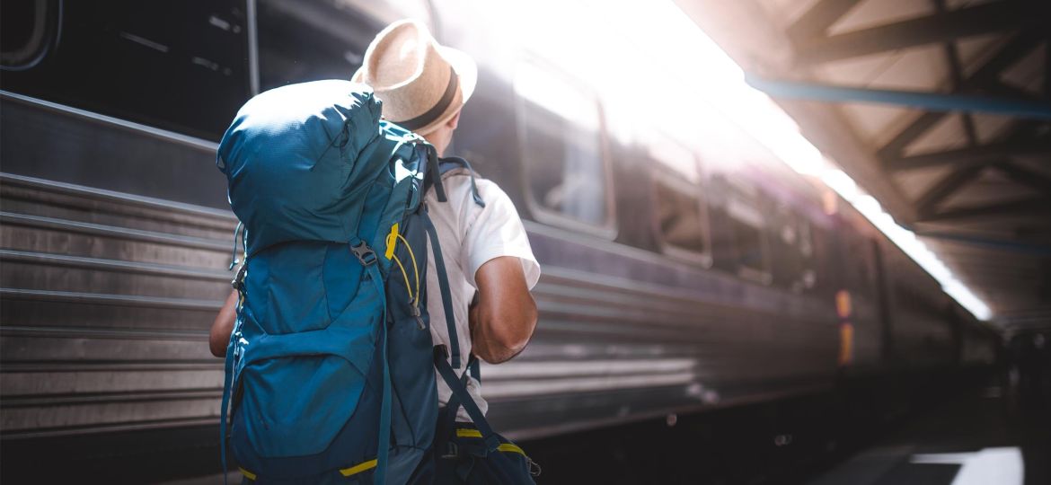 Traveler are backpacking and walking alone at train station.