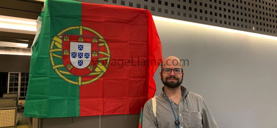 Flag of Portugal with man standing behind