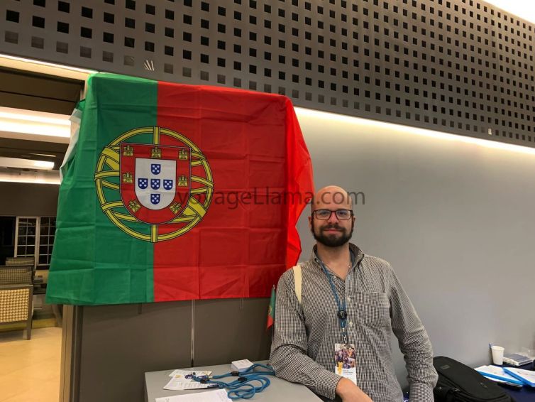 Flag of Portugal with man standing behind