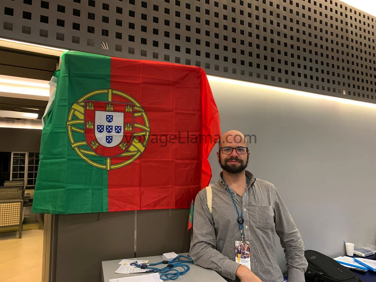 Flag of Portugal with man standing behind